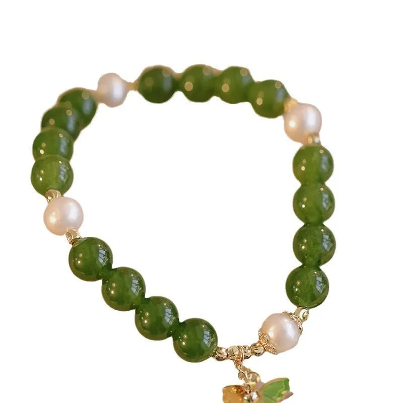 Natural green chalcedony stone bracelet with round beads in geometric arrangement