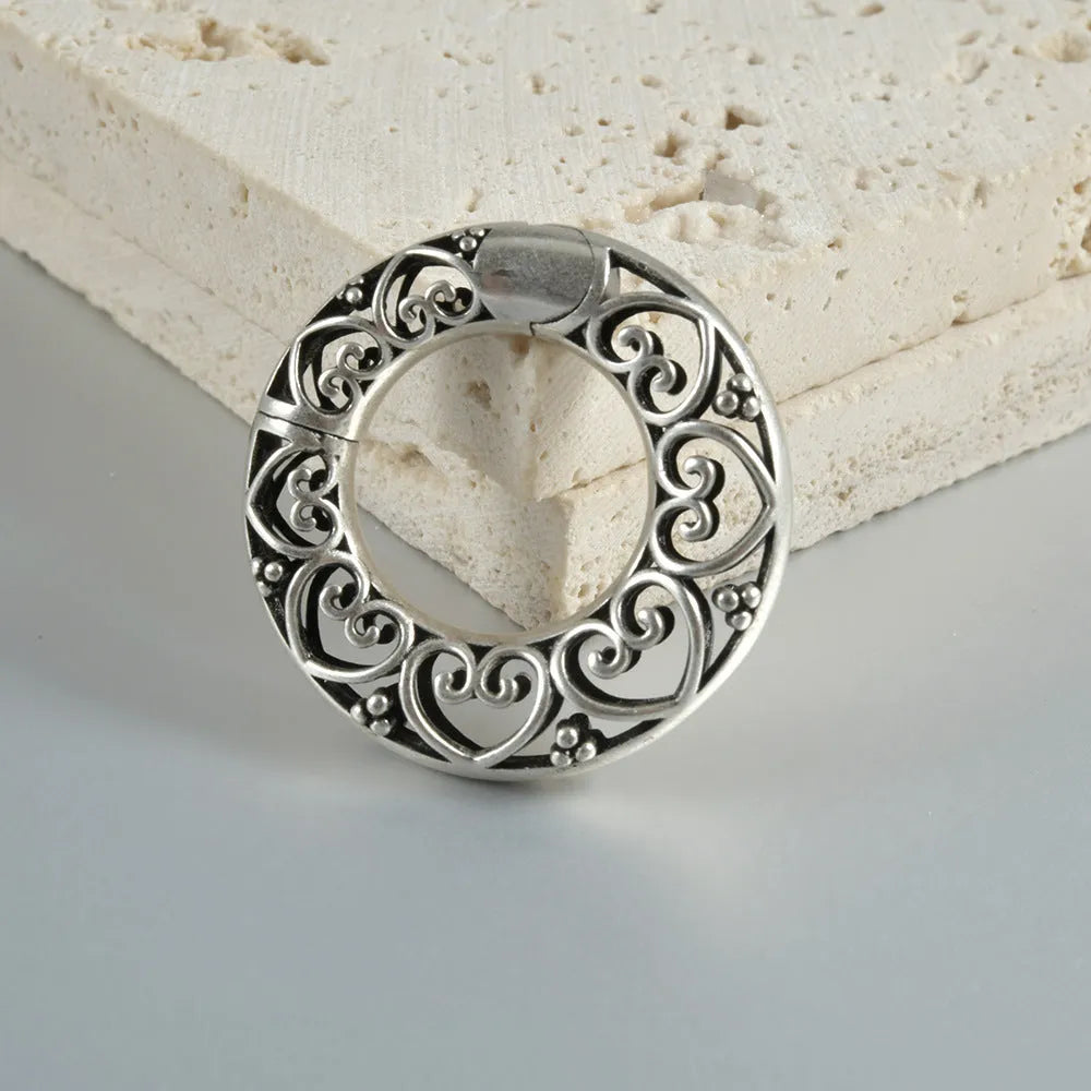 Stainless steel magnetic earrings with hollow heart or lotus design in antique silver or gold finish