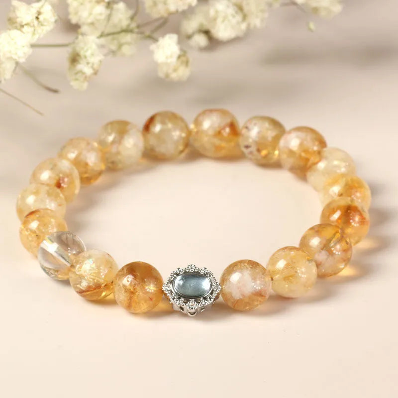 Polished citrine crystal bracelet with 10mm geometric beads on wrist