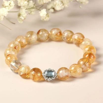 Polished citrine crystal bracelet with 10mm geometric beads on wrist