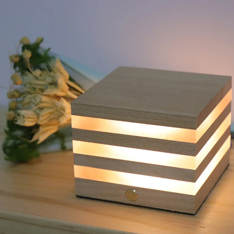 A warm, Scandinavian-inspired wooden LED night light in the shape of a heart or small house, providing cozy illumination for any room