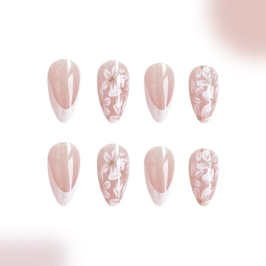 Short glossy almond false nails with glittering powder flower designs in C625 colour