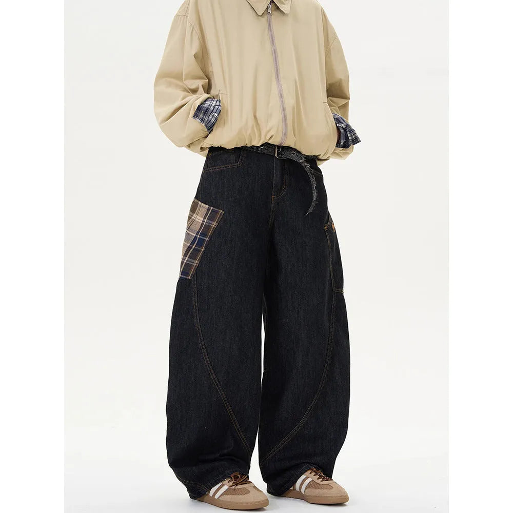 Loose straight-leg cotton trousers in a red plaid pattern, laid flat.