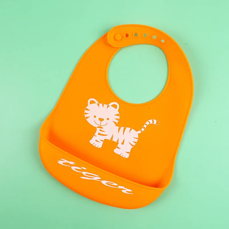 Silicone baby bib with cartoon print, waterproof and antifouling, for ages 0-6 years