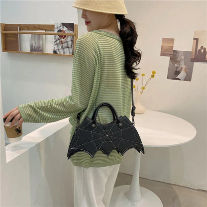 A stylish Halloween shoulder bag with a captivating spider web design, made of durable PU leather and offering ample storage space.