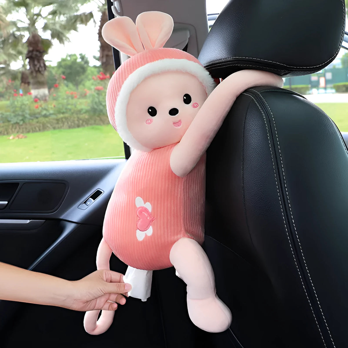 Plush animal design tissue box holder mounted on back of car seat
