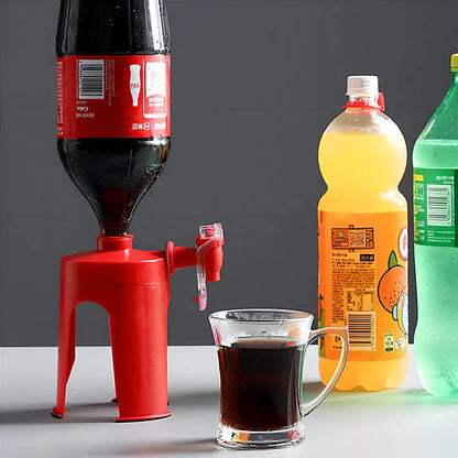 Red automatic soda dispenser gadget attached to beverage bottle for hands-free pouring
