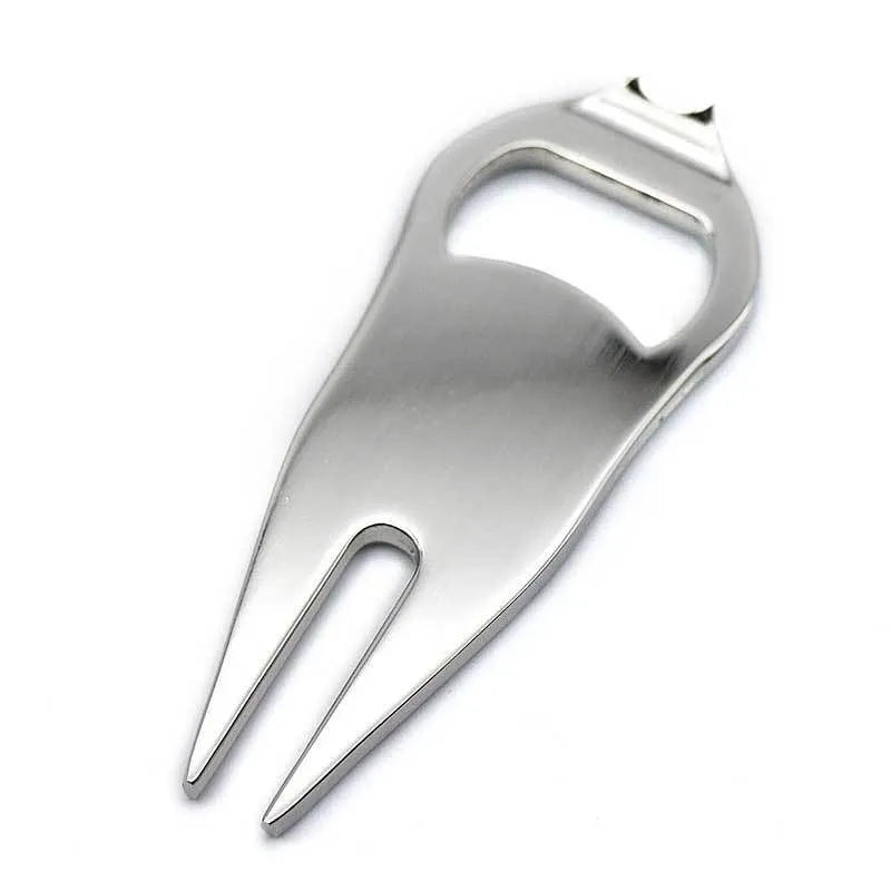 Black zinc alloy golf ball fork and bottle opener tool on a putting green.