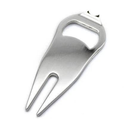 Black zinc alloy golf ball fork and bottle opener tool on a putting green.