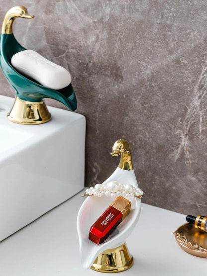 Ceramic swan soap rack in white and green, featuring a drainage cover