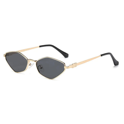 Gold metal frame rhombus-shaped cat eye sunglasses on a neutral background.