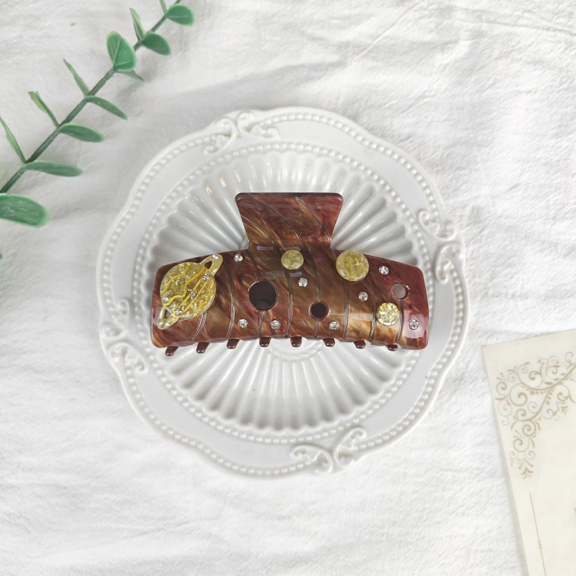 Oversized star barrettes in starry sky colours showing minimalist design and irregular elements