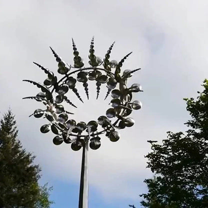 Elegant stainless steel outdoor windmill spinner with dual-layered blades rotating in opposite directions, creating a mesmerising display in the garden