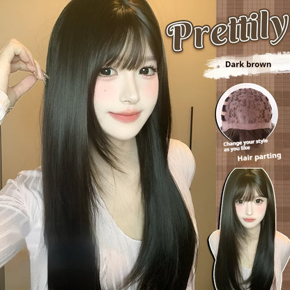 Dark brown long straight synthetic wig with fringe on a wig stand.