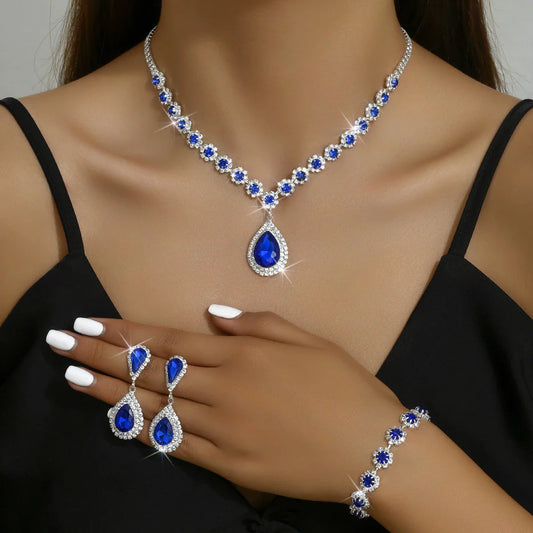 Bridal jewelry set with necklace, earrings, and bracelet featuring a sun and moon design with rhinestones