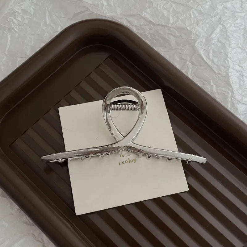 Silver metal hair claw barrette example from a range of 44 Korean-style designs.