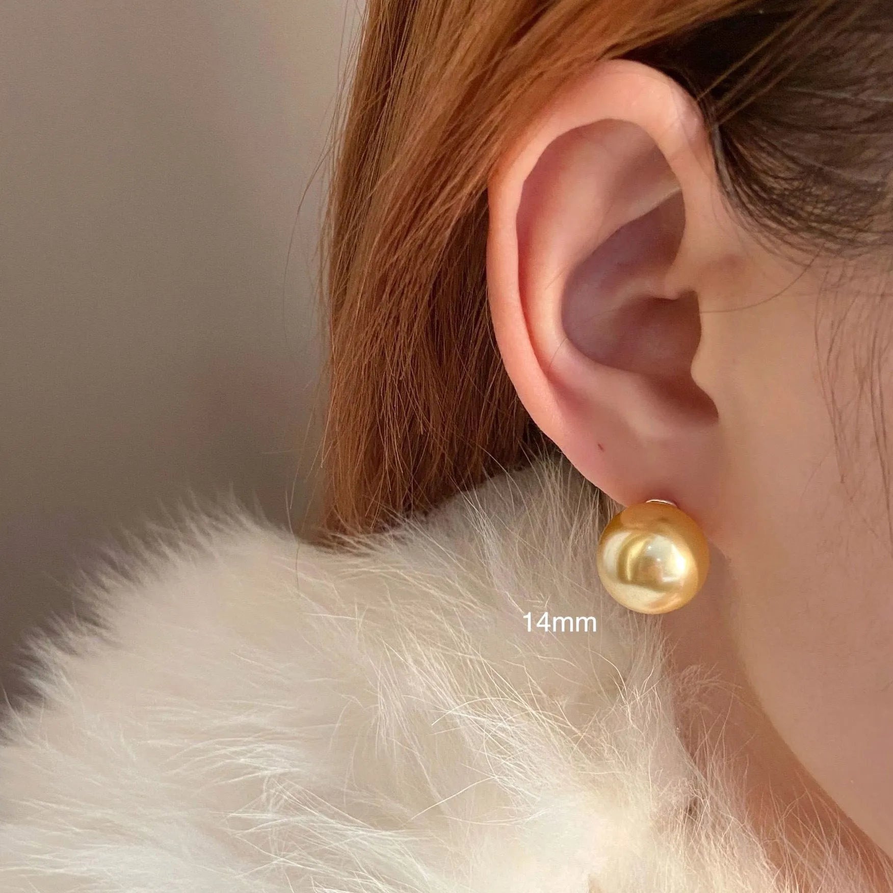 Geometric eight-point star pearl stud earrings in silver with cultured pearls, showing post-and-clasp fastening