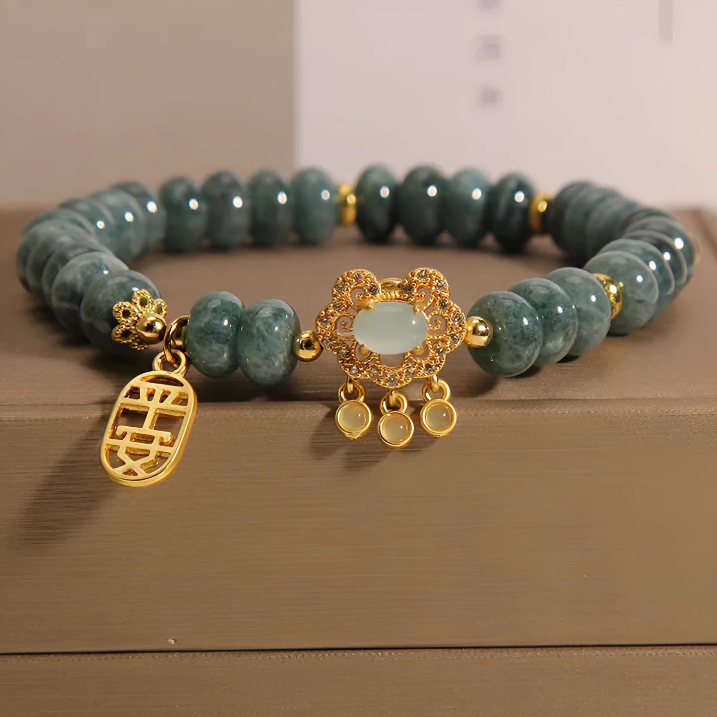 Women's natural emerald jade bracelet with abacus bead design and safety lock clasp