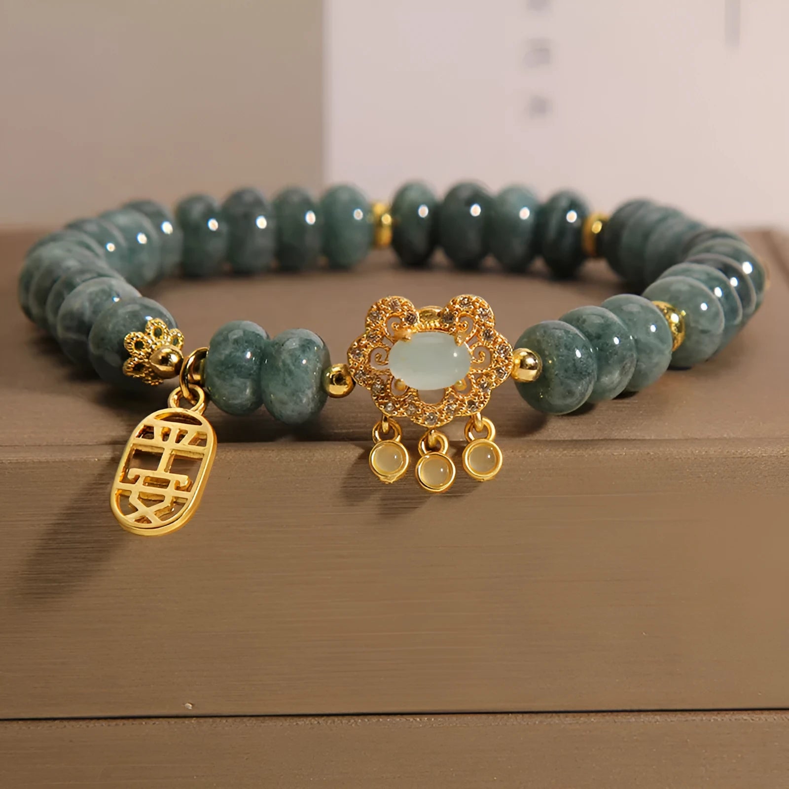 Women's natural emerald jade bracelet with abacus bead design and safety lock clasp