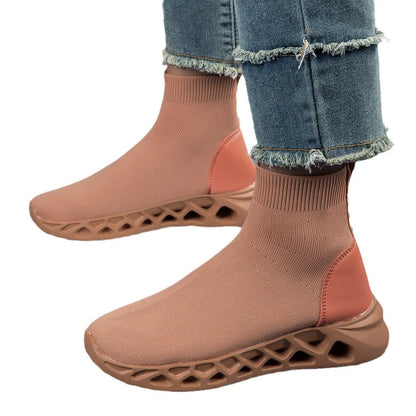 Women's casual mesh slip-on shoes in terracotta colour with flat sole and sewing line detail.