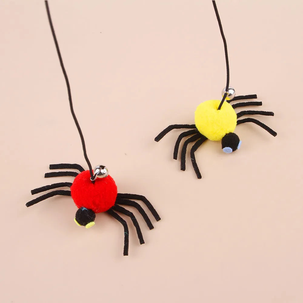 Red hanging door cat toy with elastic rope, feathers and spider-shaped bell mounted on door frame