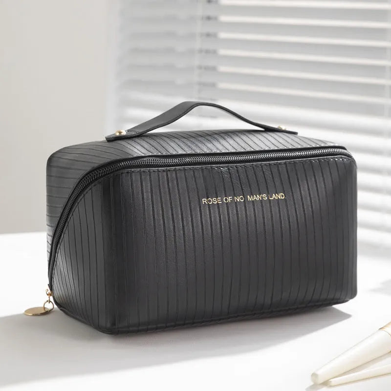 Beige cubic makeup bag with vertical pattern measuring 22.5 by 12.5 by 12.5 centimetres