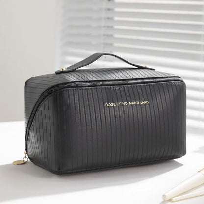 Beige cubic makeup bag with vertical pattern measuring 22.5 by 12.5 by 12.5 centimetres