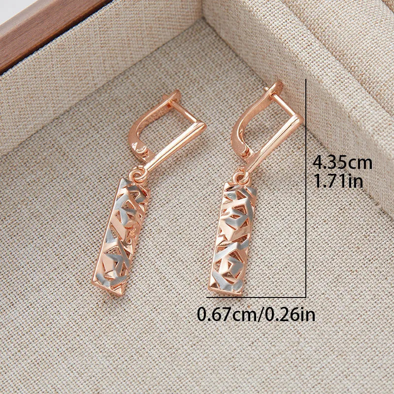 A pair of rectangular hollow stud earrings with a two-tone electroplated finish.