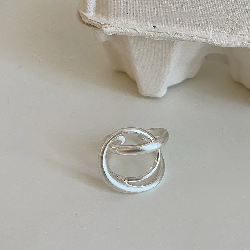Three-dimensional interlaced geometric open ring in matte metal with real gold plating