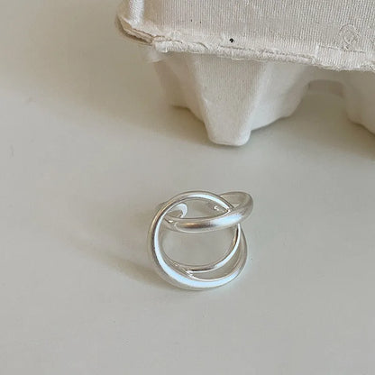 Three-dimensional interlaced geometric open ring in matte metal with real gold plating
