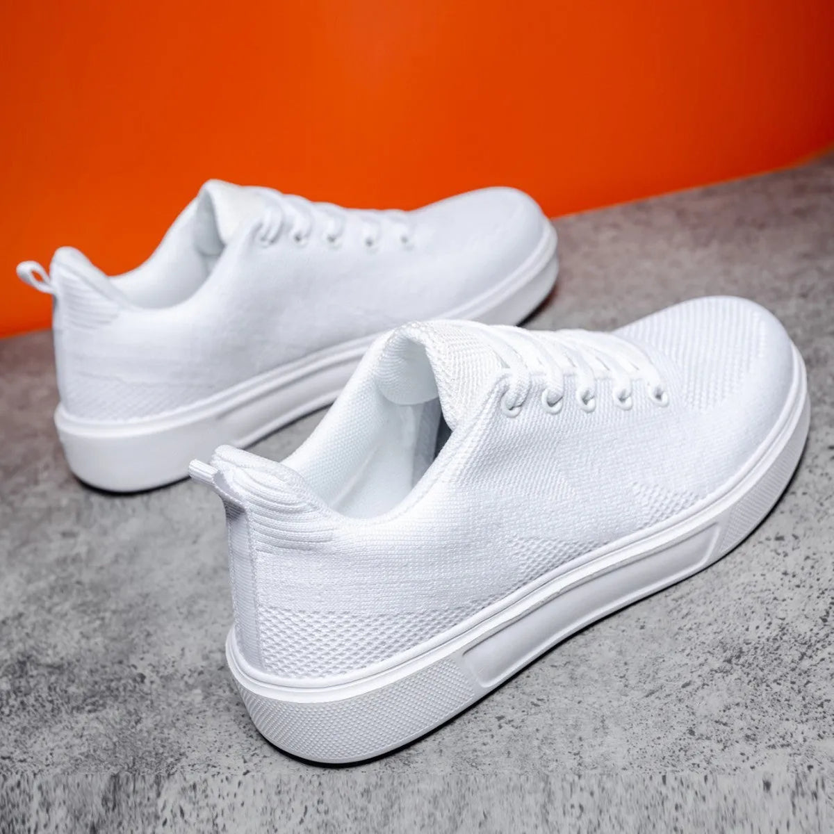 Light white and black unisex casual sports shoes with thick EVA sole and mesh upper, front lace-up.