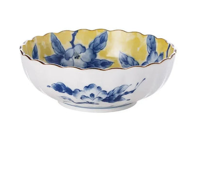 Yellow ceramic tableware set with colourful floral patterns, includes bowls and plates in Japanese style