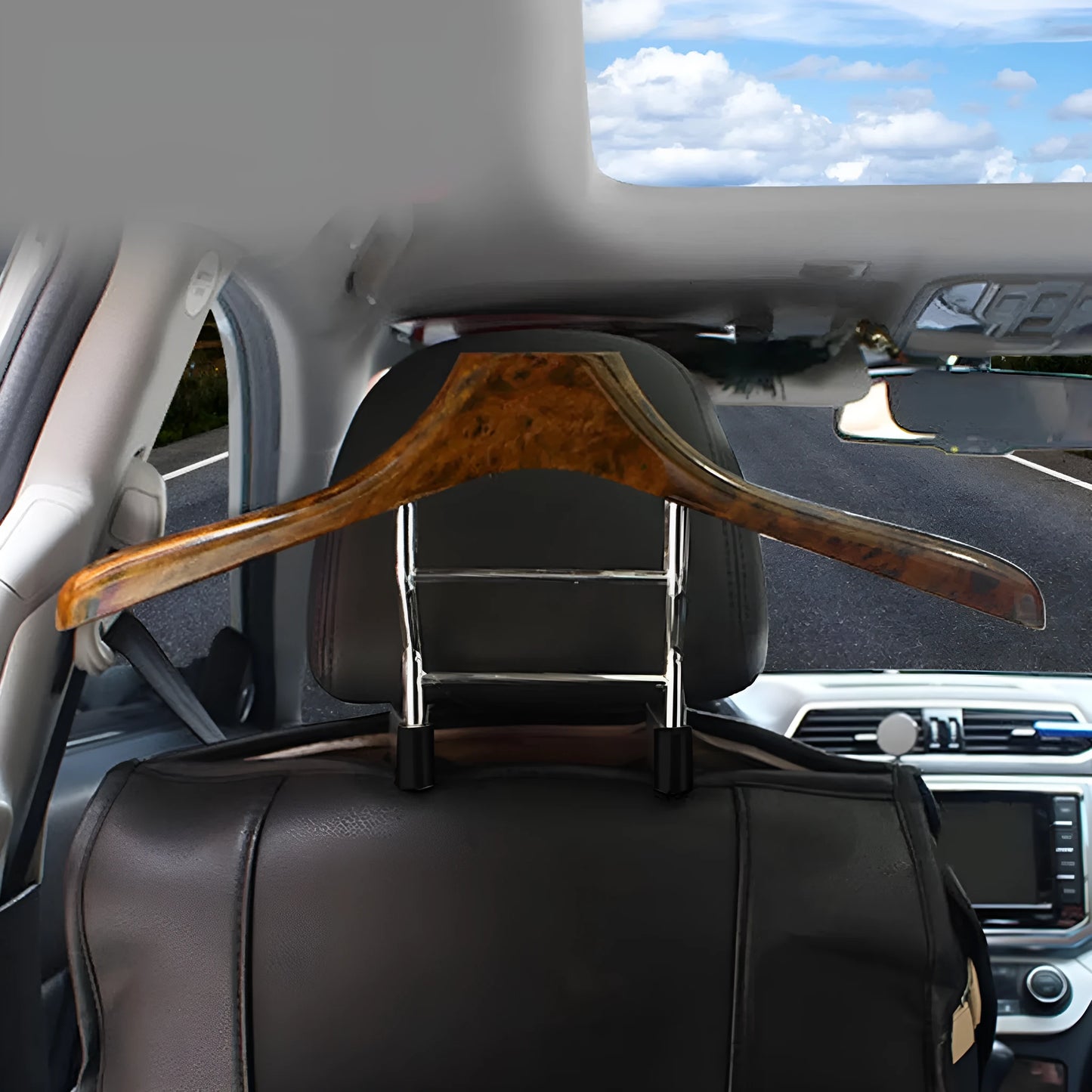Wood yellow stainless steel car clothes hanger for suits and jackets on a car headrest.