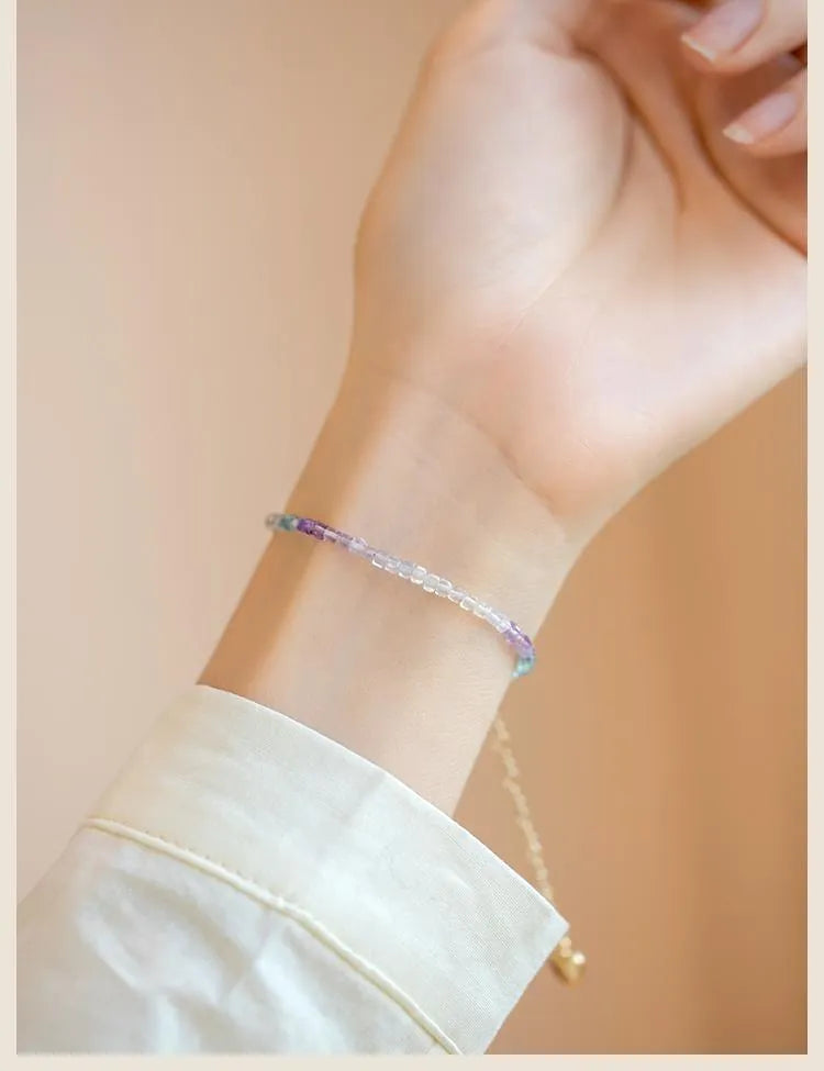 Handmade women's bracelet with rainbow fluorite stone in geometric copper links.