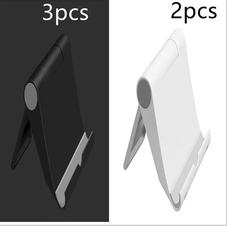 Black PE folding mobile phone stand holding a smartphone at an angle on a desktop.