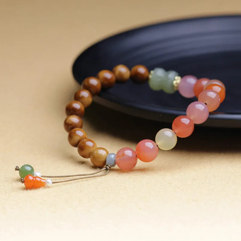 8mm diamond-shaped persimmon agate bracelet beads on wrist