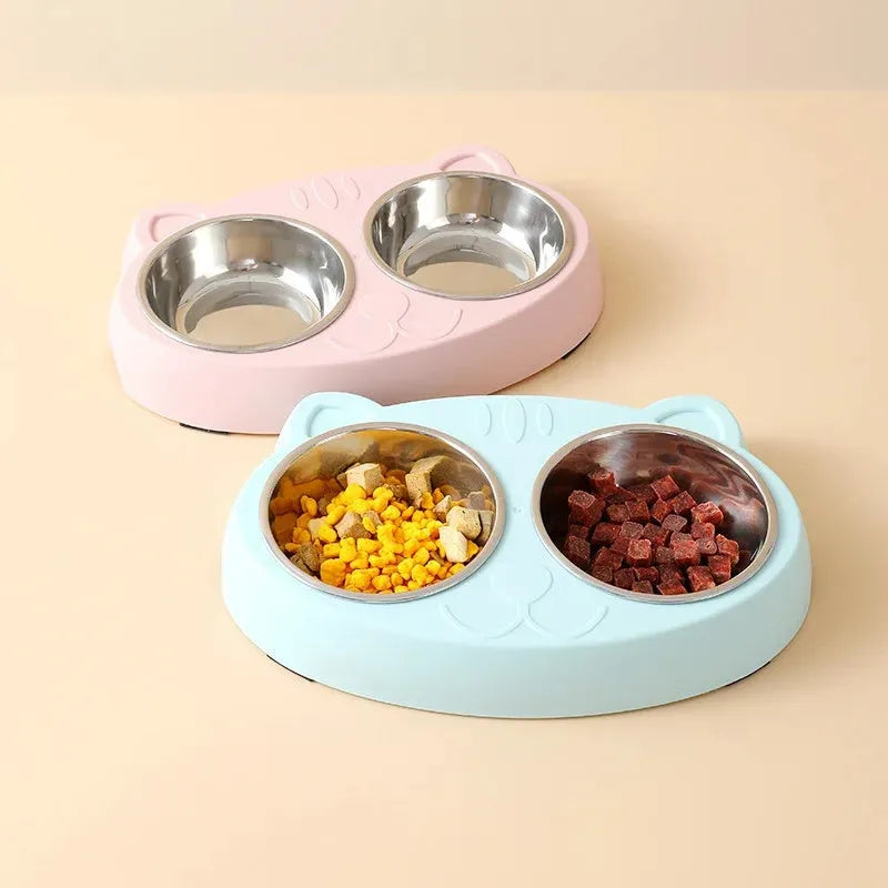 Blue macaron-shaped plastic pet feeder with two food bowls.