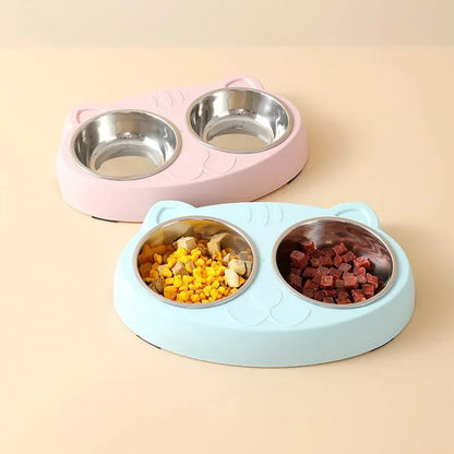 Blue macaron-shaped plastic pet feeder with two food bowls.