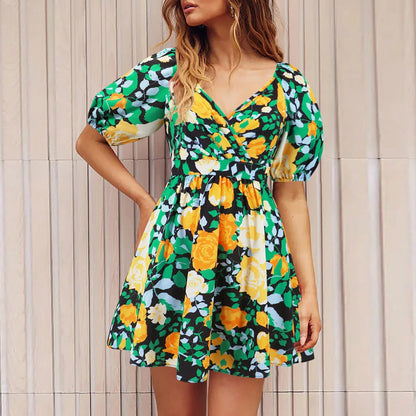 Stylish floral mini dress with V-neck and lantern sleeves, perfect for summer vacations and beach outings