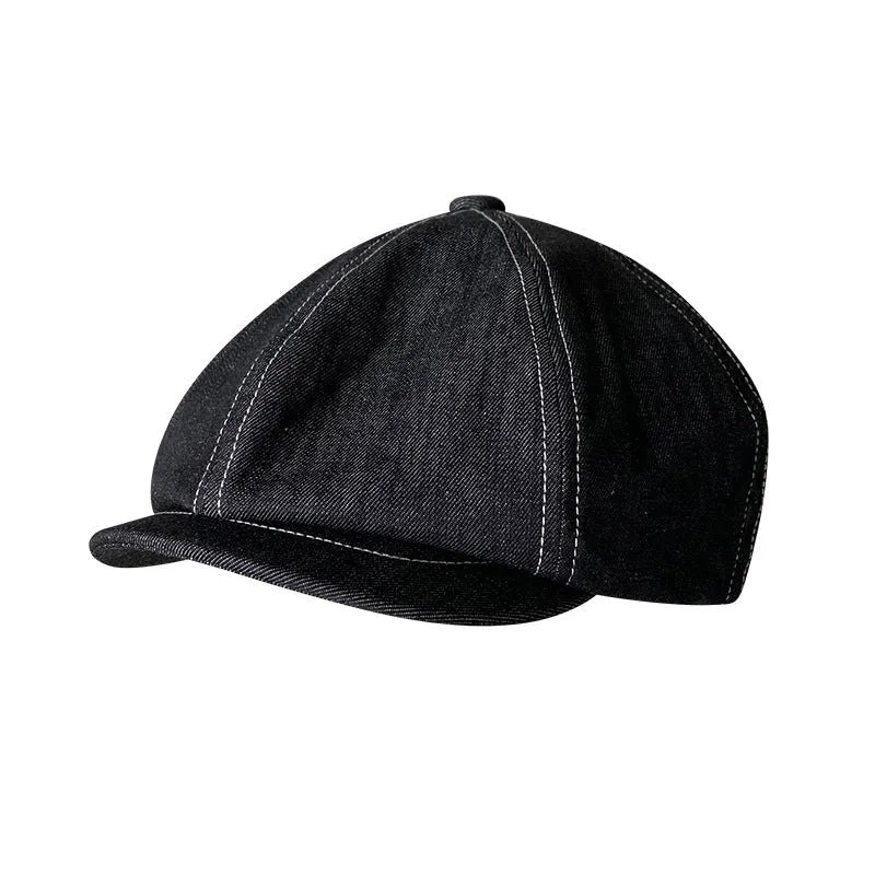 Black Japanese denim cotton beret hat showing octagonal cap style on neutral background