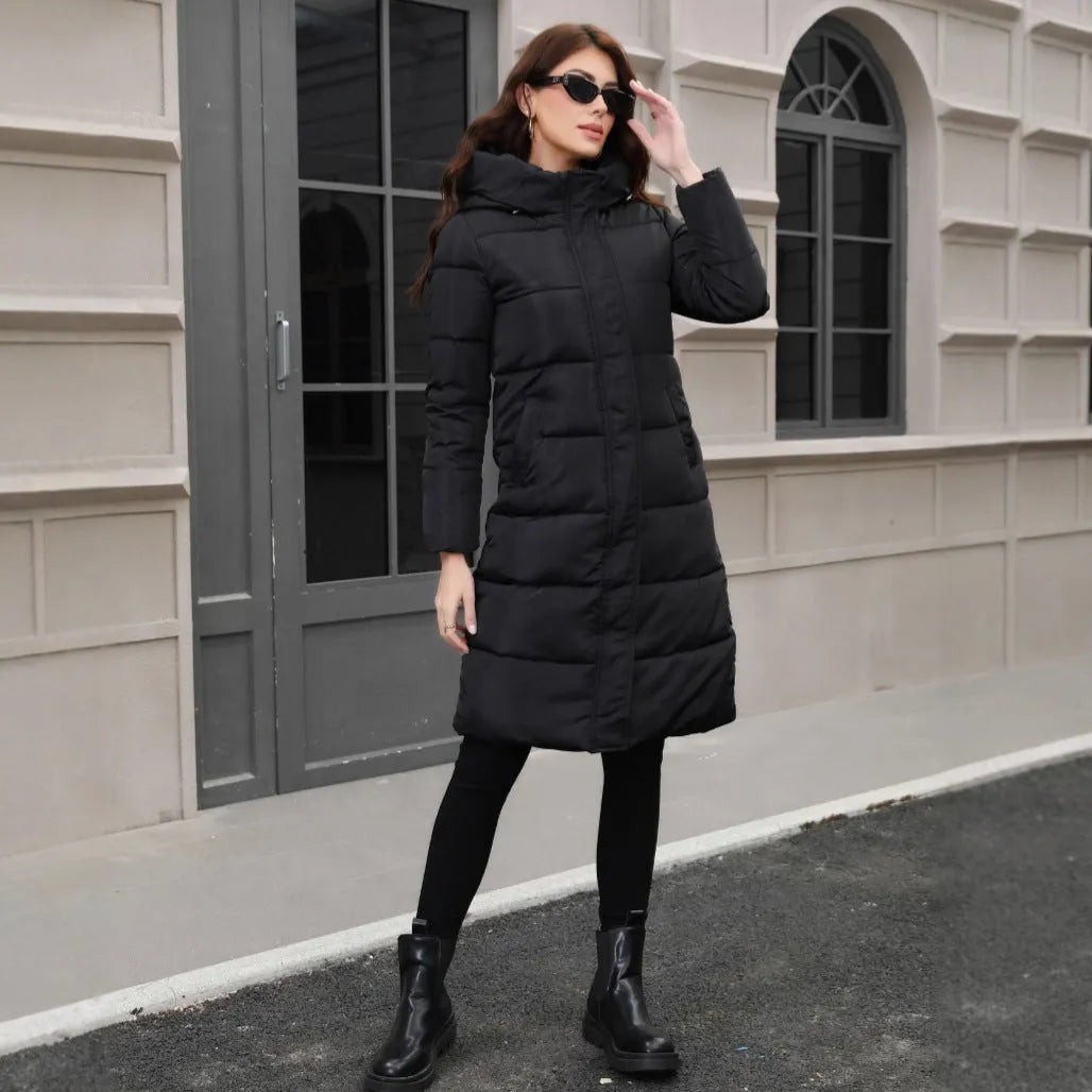Black hooded slim fit polyester jacket with long sleeves on a model showing cold-resistant construction