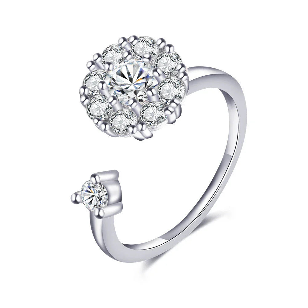 Adjustable spinner ring with rotating floral, geometric, and nature-inspired motifs for women's fashion and stress relief