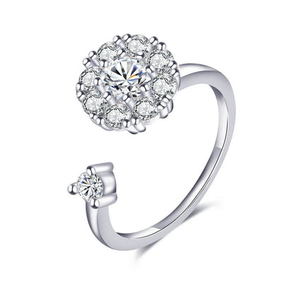 Adjustable spinner ring with rotating floral, geometric, and nature-inspired motifs for women's fashion and stress relief