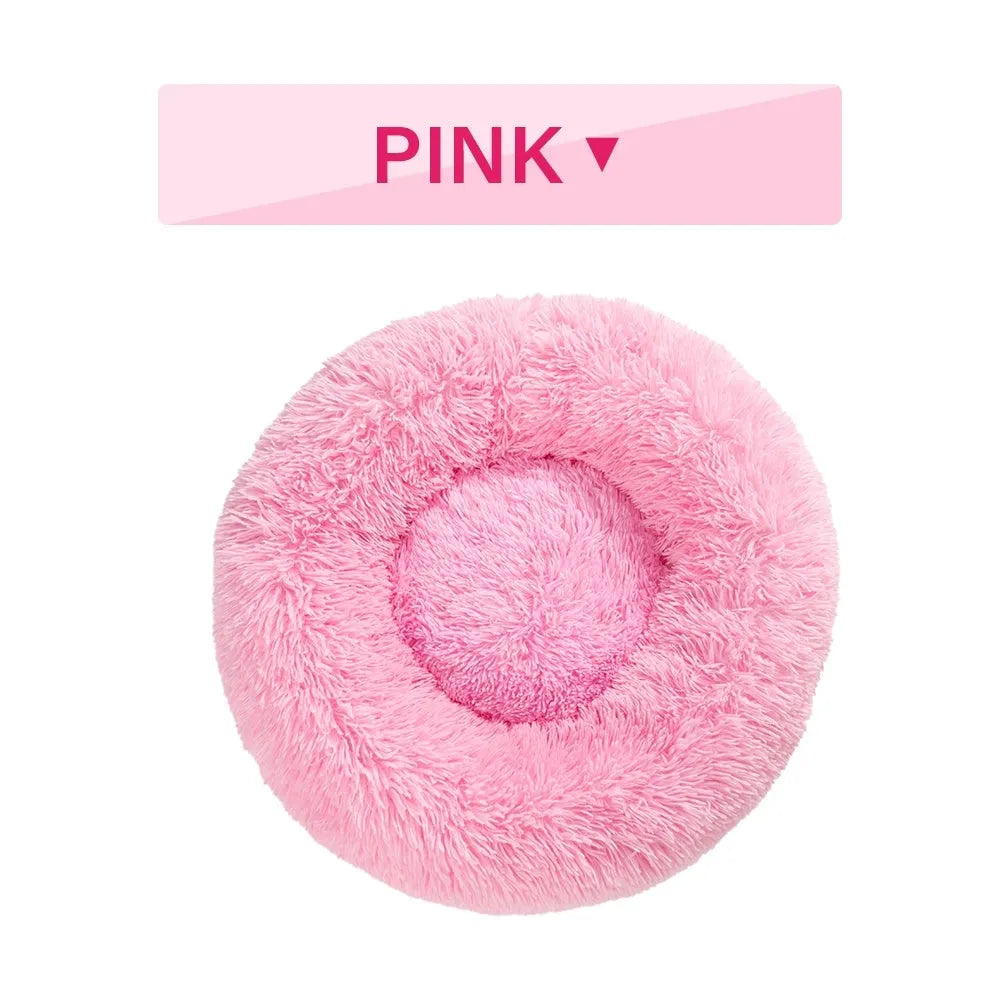 Fluffy donut-shaped pet bed with raised bolster edge in long plush material