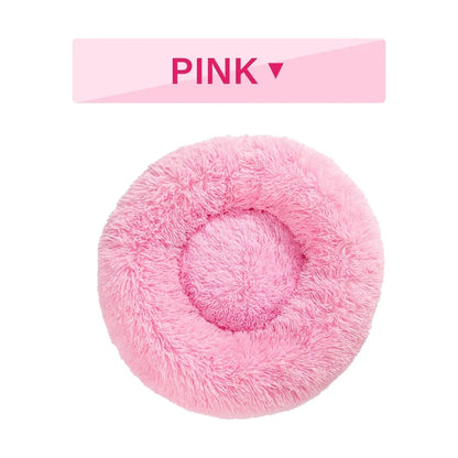 Fluffy donut-shaped pet bed with raised bolster edge in long plush material