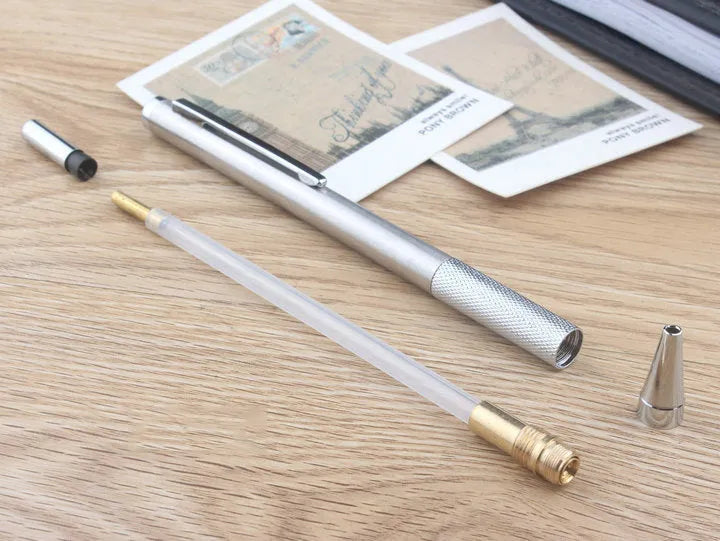 Metal automatic mechanical pencil showing multiple lead diameter options including 0.5 mm, 0.7 mm, 0.9 mm, 1.3 mm, and 2.0 mm