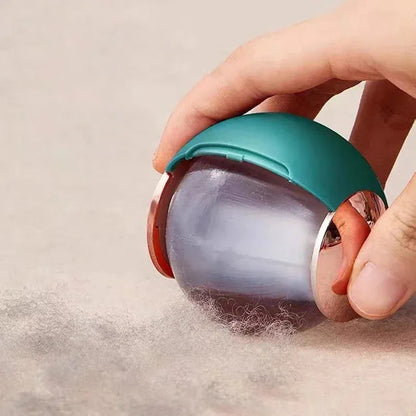 Washable reusable lint roller ball with handle for removing pet hair from fabrics.