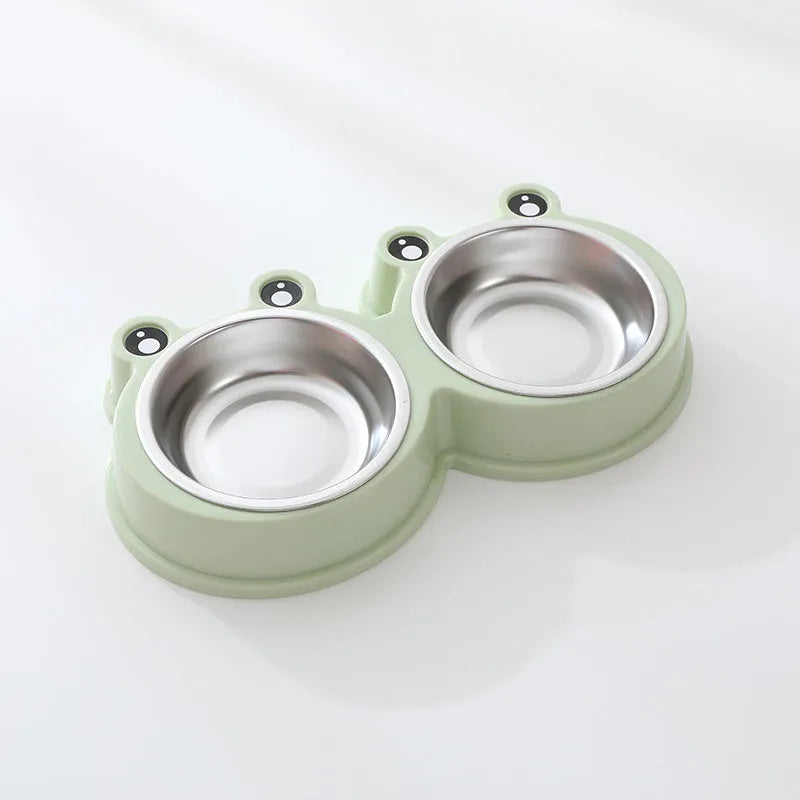 Stainless steel pet bowl with frog design and two compartments for food and water.