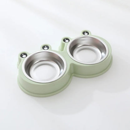 Stainless steel pet bowl with frog design and two compartments for food and water.