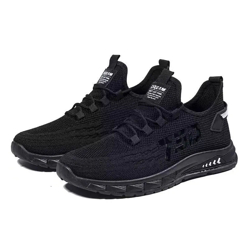 Low-top casual sneakers with striped mesh upper and flat plastic sole in grey colour.